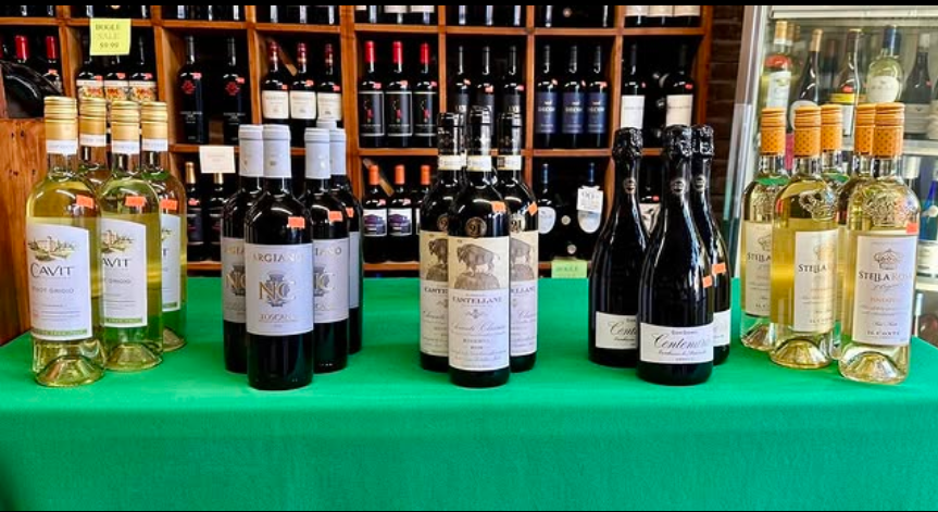 Flyer for Italian Wine Tasting at Dean's Liquor with images of Italian wine bottles on a green tablecloth