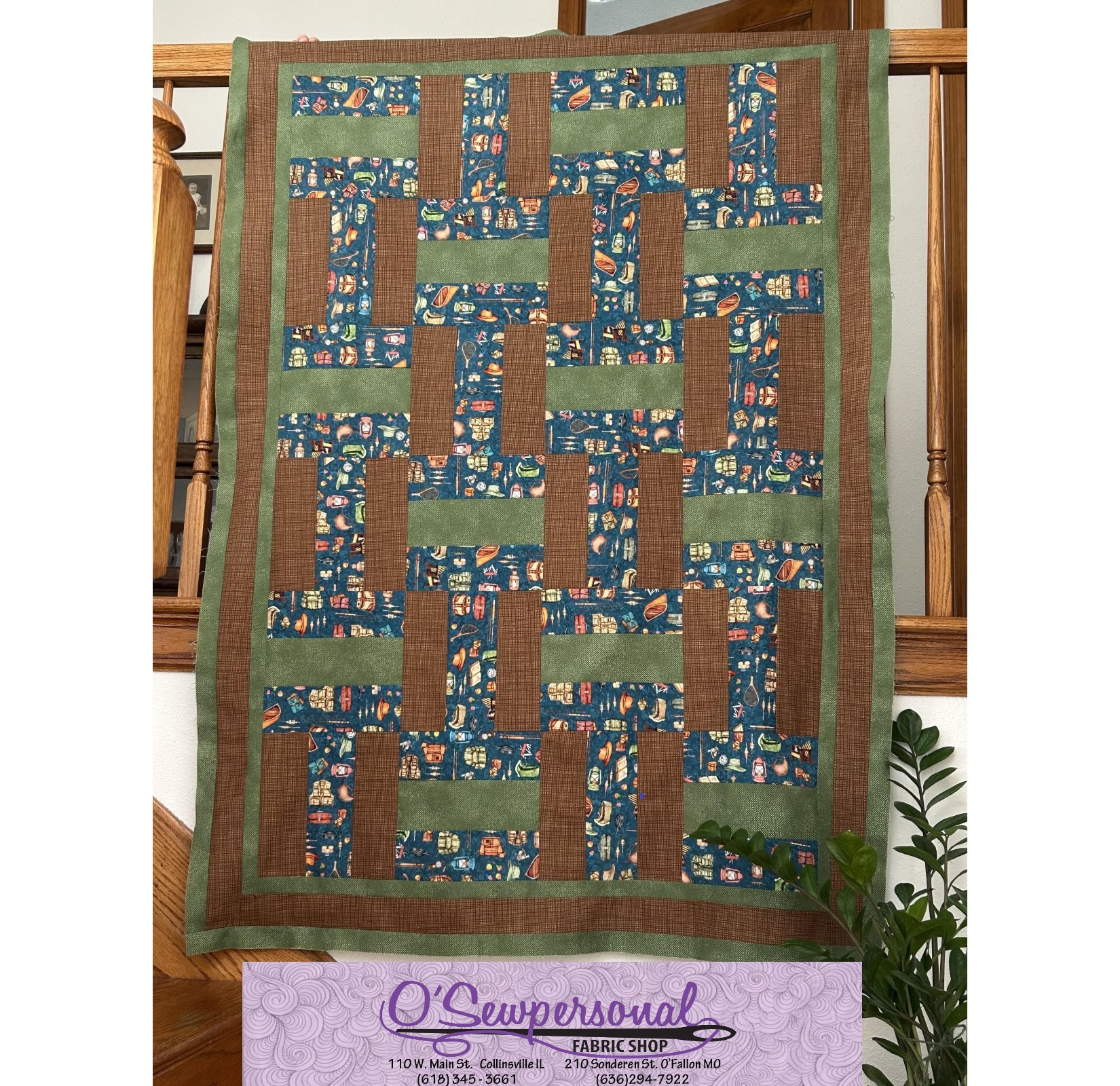 Image of quilt in shades of blue, green, and brown with O'Sewpersonal logo at bottom