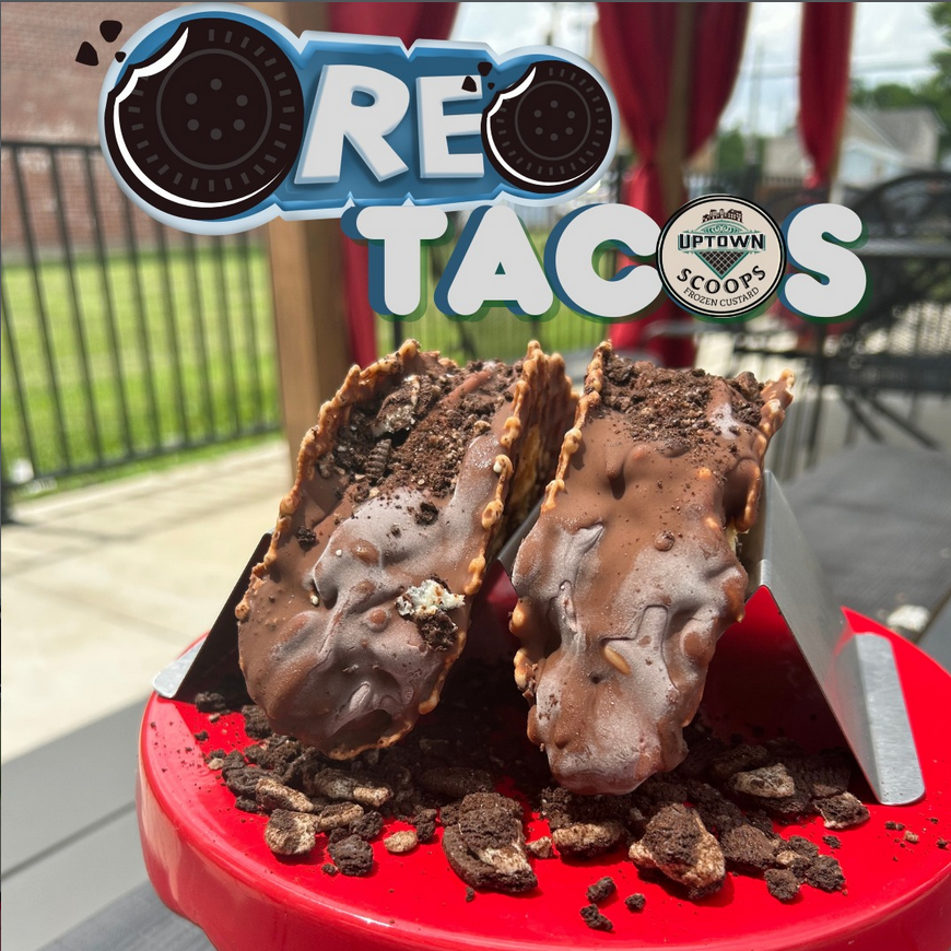 Image of two "tacos" made from waffle cone and ice cream with chocolate hardshell dip with words Oreo tacos to advertise taco tuesday.